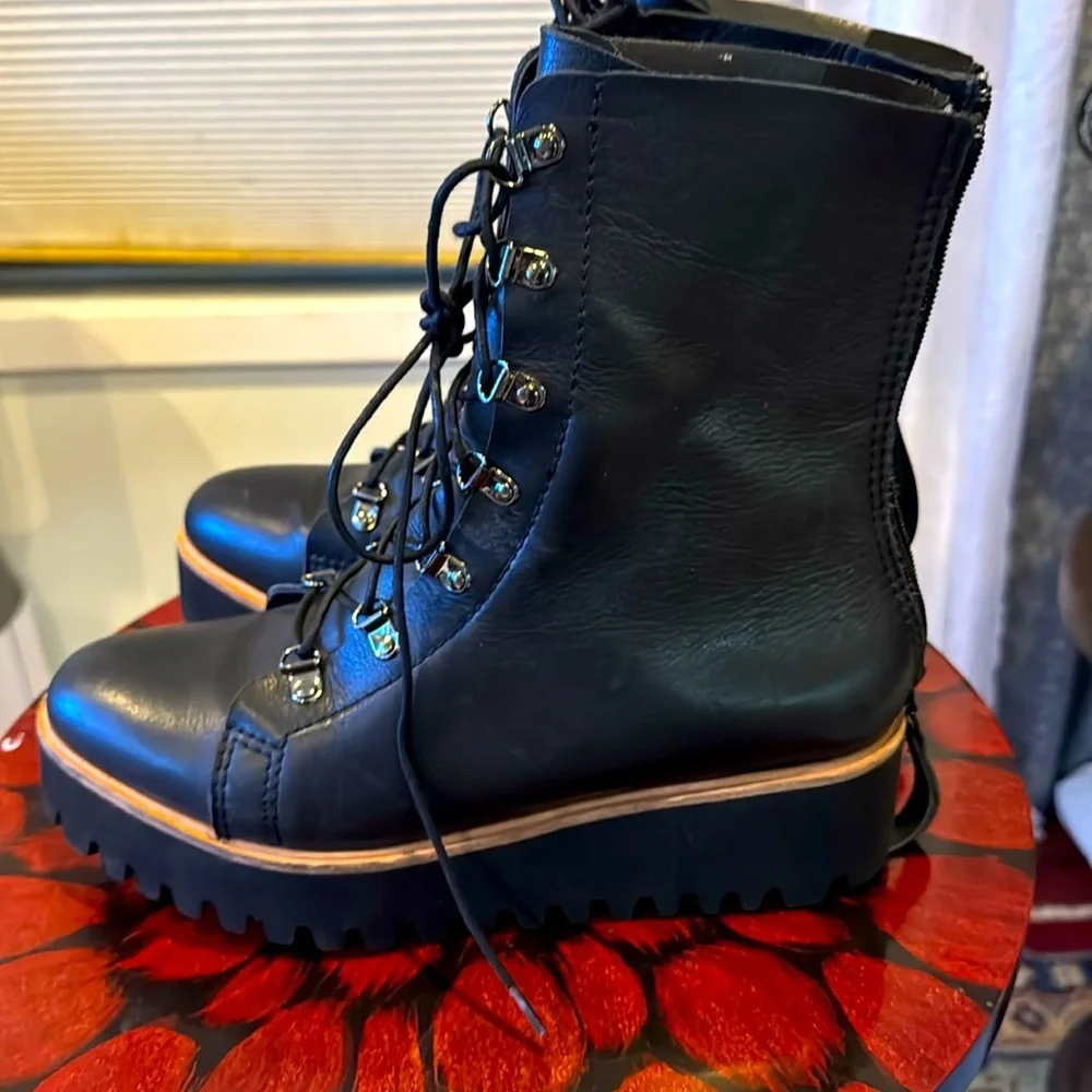 Absolutely gorgeous ALL BLACK platform Boots like new!